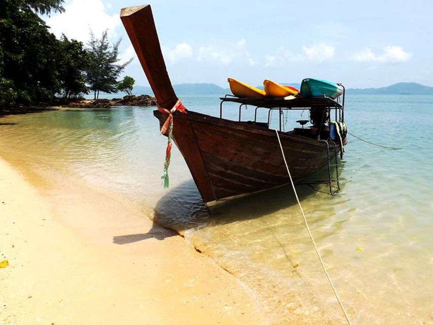 Ko Lanta: Full-Day Love Kayak Caves & Beaches Kayak Tour - Reaching Ko Talabeng by wooden long-tail boat