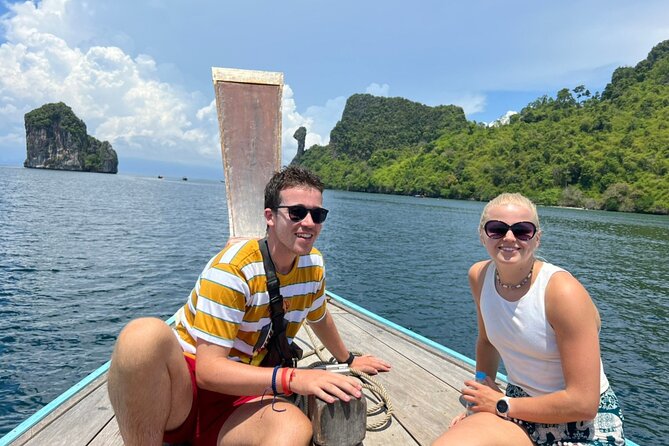 Krabi 7 Islands Snorkeling & Plankton Night by Big Longtail Boat - Sunset, with a crowd and a mountain in the way