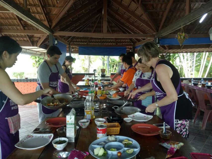 Krabi: Cooking Class at Thai Charm Cooking School with Meal - Pounding curry paste by hand