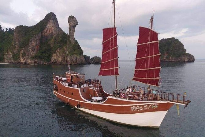 Sunset Dinner Cruise with night Swimming by Luxury Junk Boat - A sunset cruise built around swimming, food, and scenery